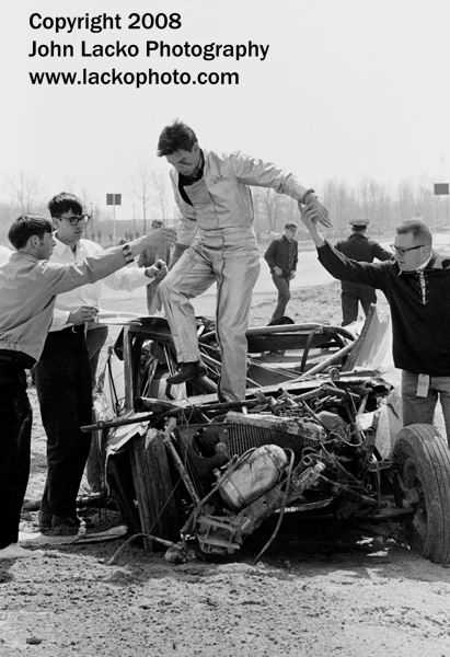US-131 Dragway - BRANNAN IS HELPED OUT OF HIS WRECK AFX MUSTANG AFTER FLIPPING IT MAY 1966 FROM JOHN A LACKO WWW LACKOPHOTO COM
